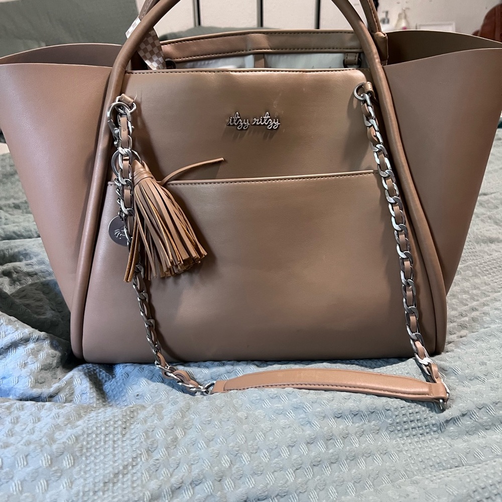 Itzy Ritzy Tan Tote with Tassel Accent and Adjustable Straps